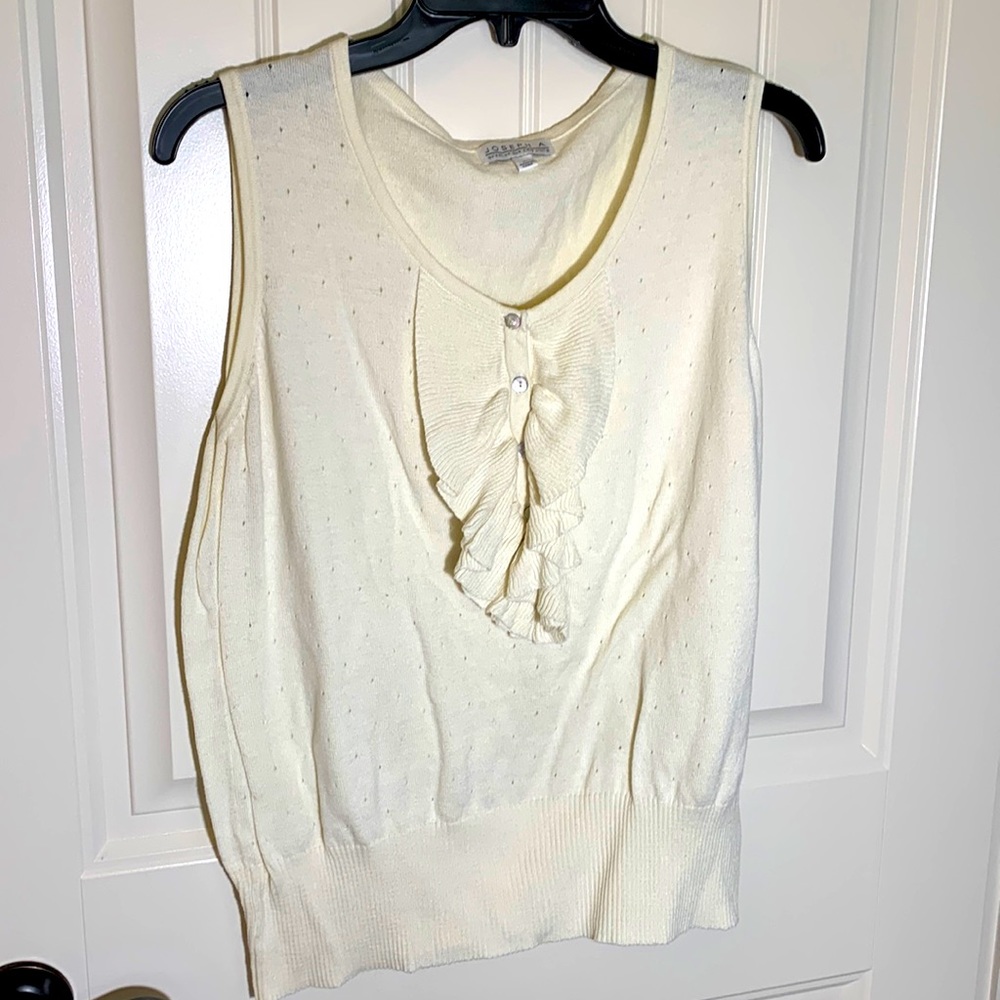 Sleeveless sweater. Great under jackets or shrugs.